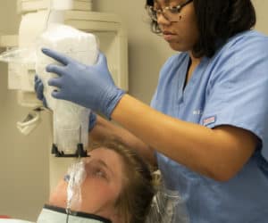 MedQuest College student using dental technology