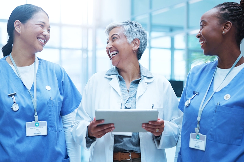 nurses talking to a doctor